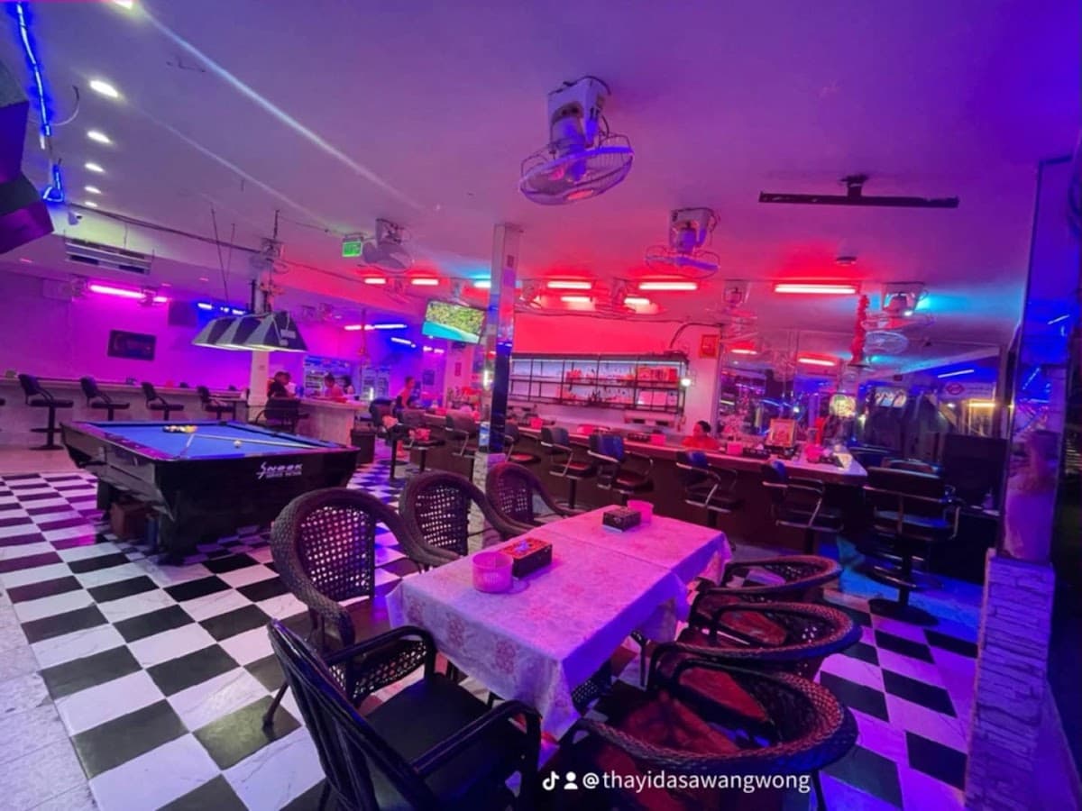 Cozy bar with neon lights on a quiet Naklua street at night in Pattaya